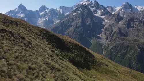 Group of Hikers Trekking Through Rocky Mountain Terrain