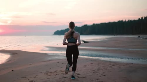 Woman Running Sunset Sunrise Sand Beach Healthy Lifestyle Outdoor Cardio Activity Back View Slowmo