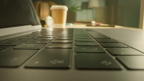 Close-up Macro Shot: Person Opens Laptop Computer and Starts Typing. Focus on Hands and Keybroard.