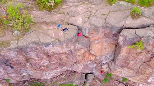 Rock Climbers on Steep Rocky Cliff, Aerial Drone