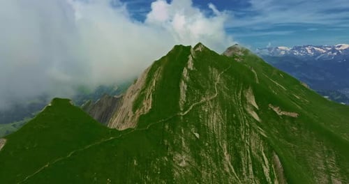 Drone Flies Over Green Picturesque Valley with Mountains in the Background High Mountains Famous