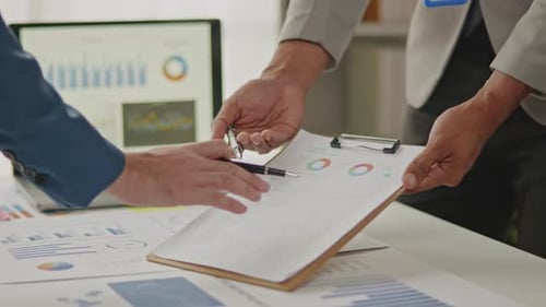 Close up of business hands are working and brainstorming on paperworks.