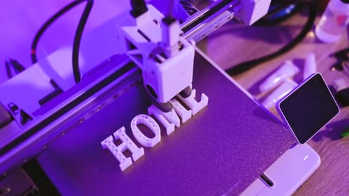 Imprimante 3D créant Word HOME