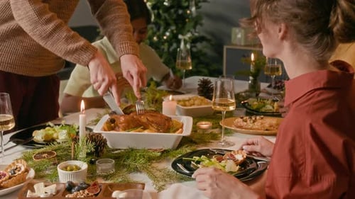 Friends Enjoying Christmas Dinner Together at Home