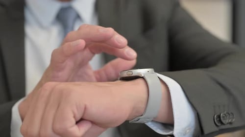 Close Up of Businessman Using Smart Watch