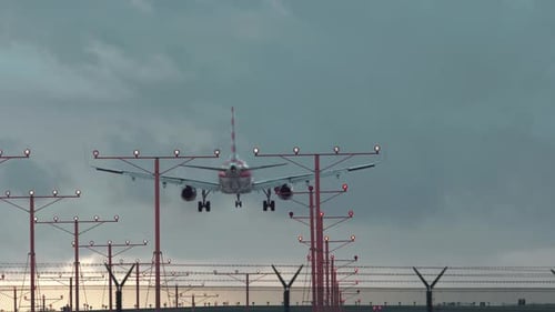 Jet airliner landing on runway.