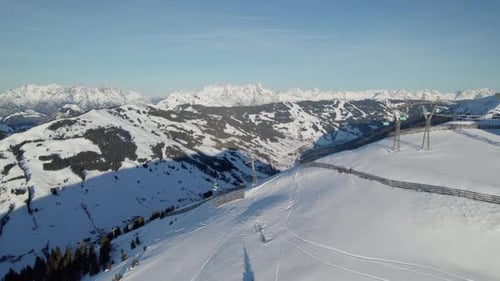 Snowy Mountain Range Aerial View on Sunny Winter Day