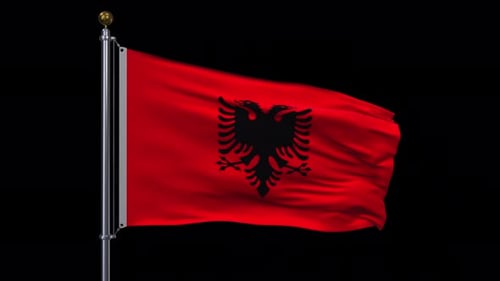 Albanian Flag Waving on Flagpole with Black Background