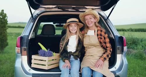 Mother and Daughter at Lavender Farm with Flowers