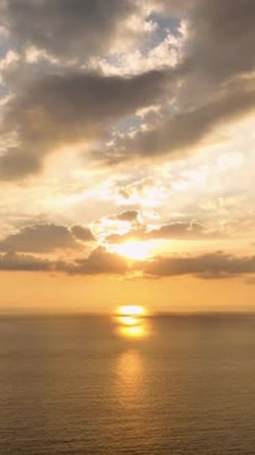 Vertical Video Aerial Sunset Splendor Magnificent Views of a Stunning Sea Sunset