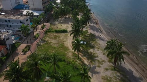 Tropical Beach and Urban Buildings Aerial View