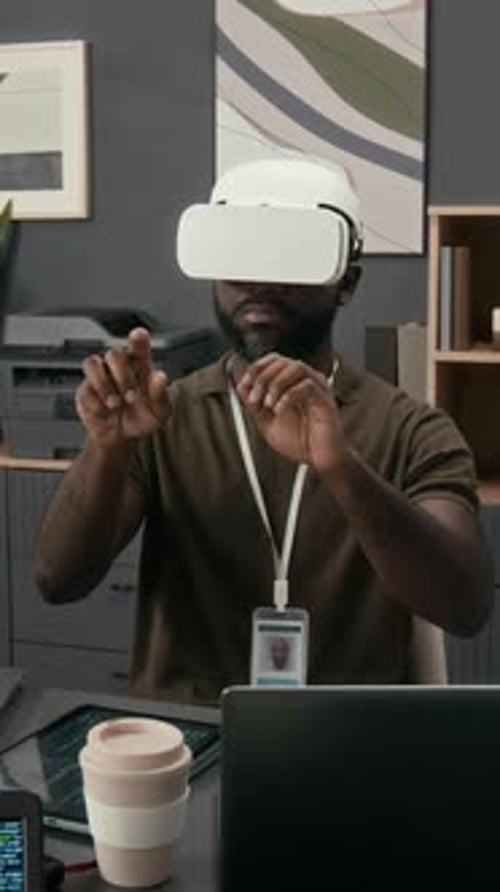 Man Uses VR Headset in Modern Office