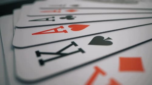 Playing Cards Spread on Dark Table - Close-Up Shot