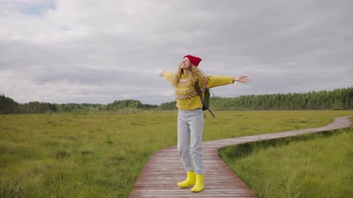 Female Hiker Happily Jumping and Spinning in Place Girl Expressing Happiness Joy From Traveling