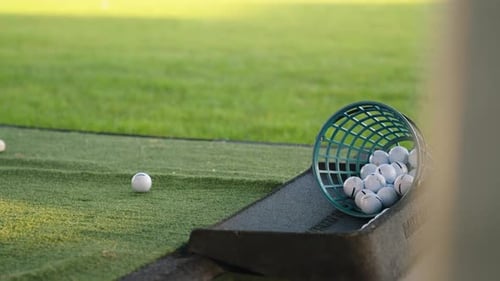 Golf Ball Being Struck on the Driving Range - Close Up
