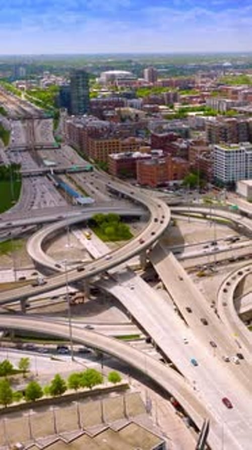 Crossroads and highways, motorways junctions in Chicago. Traffic of Metropolis on sunny day.