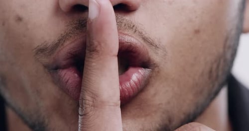 Closeup of mouth, man and finger to lips, silence and secret with mystery