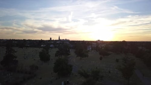 Aerial shot overhead a large graveyard in Georgia during sunset