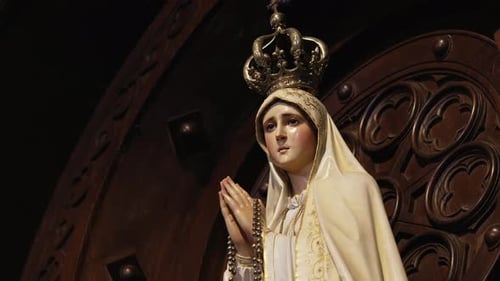 Sacred statue of Virgin Mary with crown