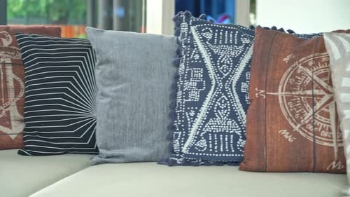 Collection of Decorative Pillows on Bright White Sofa