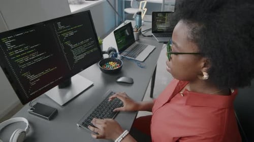 Black Female Programmer Working on Computer in Office
