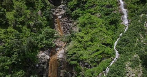 Drone shot captures Nepal’s waterfall and river flooding amidst the dense forests of Sindhupalchowk