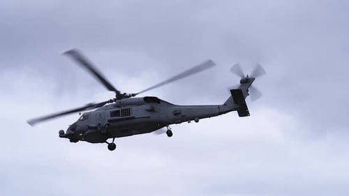 Military Gray Helicopter Flying in Cloudy Sky