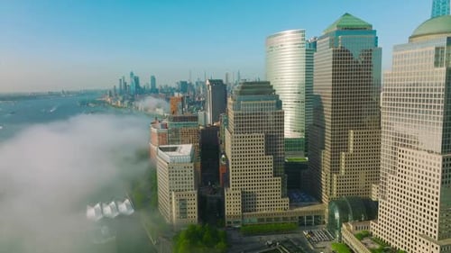 Sun rays reflecting in the windows of beautiful skyscrapers in Lower Manhattan Financial District.