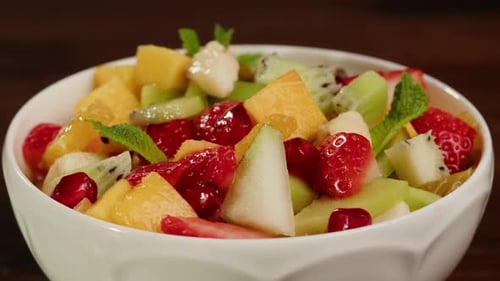 Colorful Fruit Salad in White Bowl, Close Up