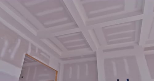 Bright Room During Construction with Drywall and Coffered Ceiling