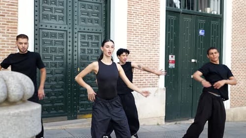 Group of Street Dancers Performing Synchronized Contemporary Choreography