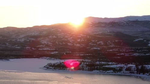 Golden Sun Shining Over The Snowy Mountain in Winter. - aerial shot