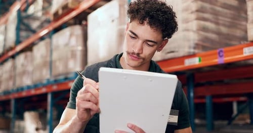 Businessman, logistics and writing with clipboard in warehouse for inventory checklist or stock