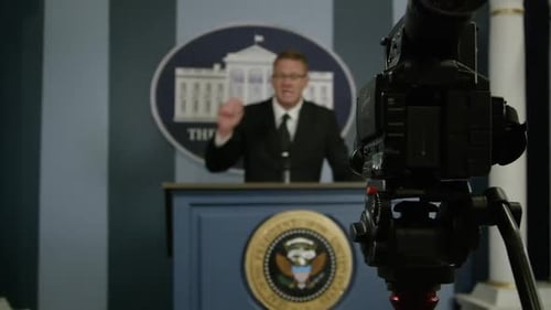 Press secretary at white house podium in front of cameras HD