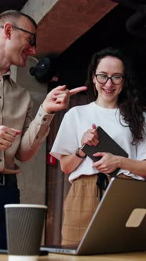 Cheerful office workers in the spacious office.