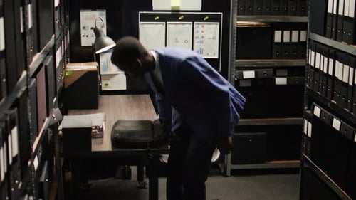 Man Arriving at Small Cramped Office Space