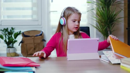Girl Learning on Tablet at Home at Desk