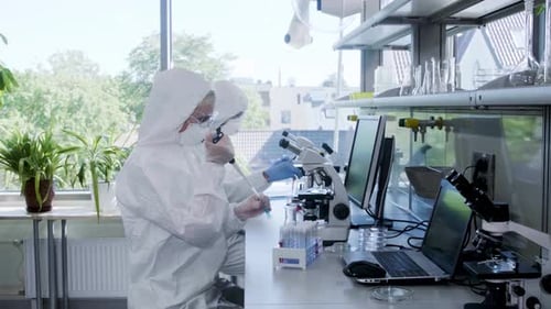 Scientists Working in Bright Modern Laboratory