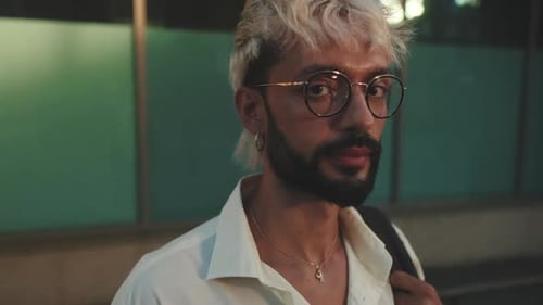 Stylish Man Smiles at Night in the City