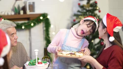 Festive Family Celebrates Christmas with Cookies