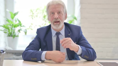 Online Video Chat Senior Old Businessman in Office