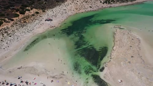 Top down view of Balos Beach and Lagoon with turquoise water, mountains and cliffs in Crete, Greece