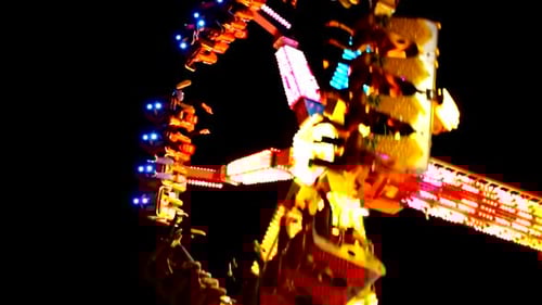 Amusement park. Colorful rotate carousel illuminated.