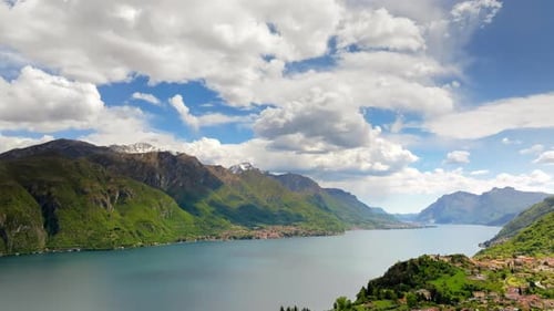Lateral Aerial drone panorama of Lake Como surrounded by mountains in Italy