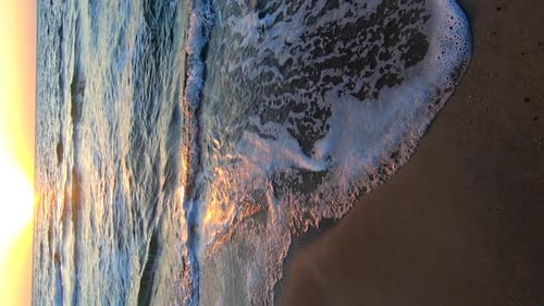 Sea Waves White Foam Rolling on Sandy Beach Sea Coast Dawn Sunset Sea Vertical