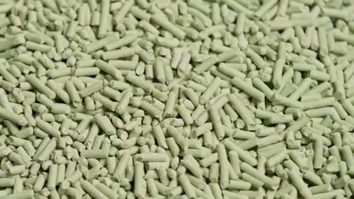 Overhead View of Compacted Wooden Sawdust Pellet Rotating