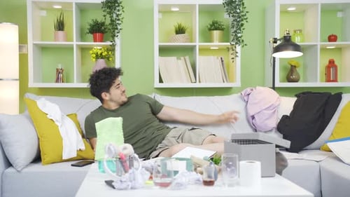 Lazy Man Reaches Around on a Sofa