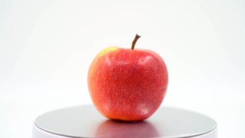 Red apple close up on white background isolated 4K