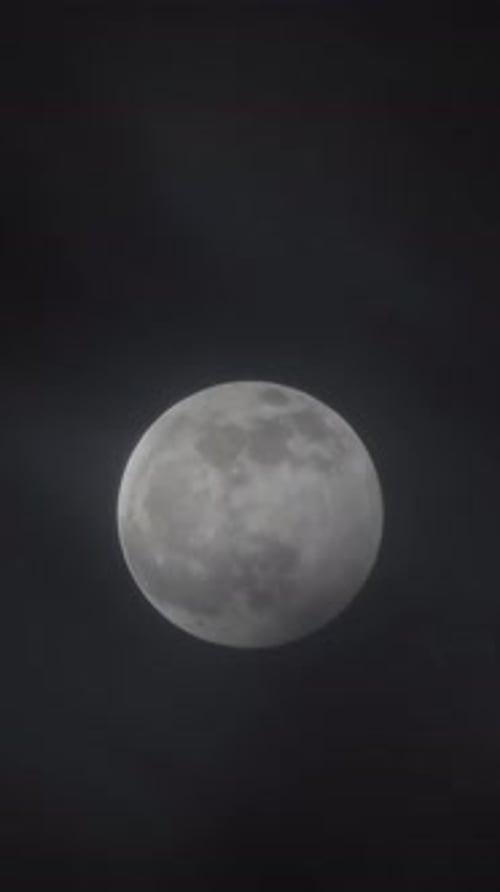 full moon moving between clouds, timelapse