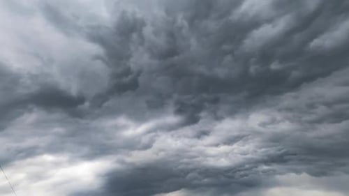 Dramatic cloudscape spreading by the atmosphere. Low angle view on the formation of rainy clouds.